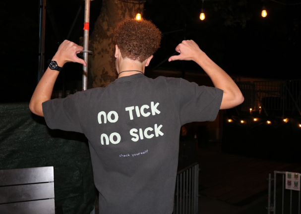 Ian McKinney has a notice on the back of his t-shirt, urging people to be wary of tick bites.