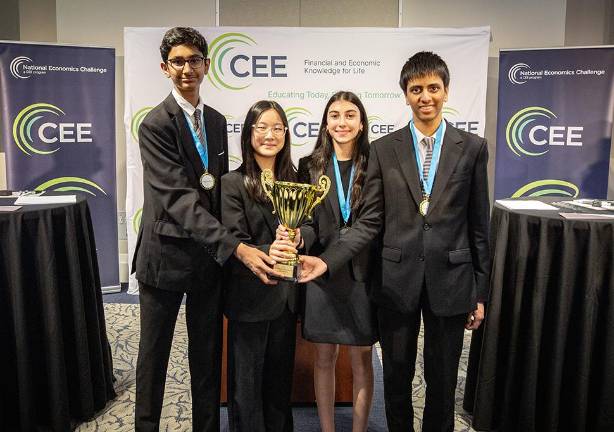 (L to R) Ronav Shah, Maile Meyoung Thung, Ivy Ponda and Mihir Kumar hold the National Economics Challenge trophy after winning the David Ricardo Division in Atlanta.