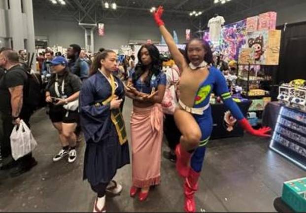 Three friends show off their cosplay: two Jujutsu Kaisen cosplaysSuguru Geto and Fumihiko Takaba surround Nico Robin from “One Piece.”