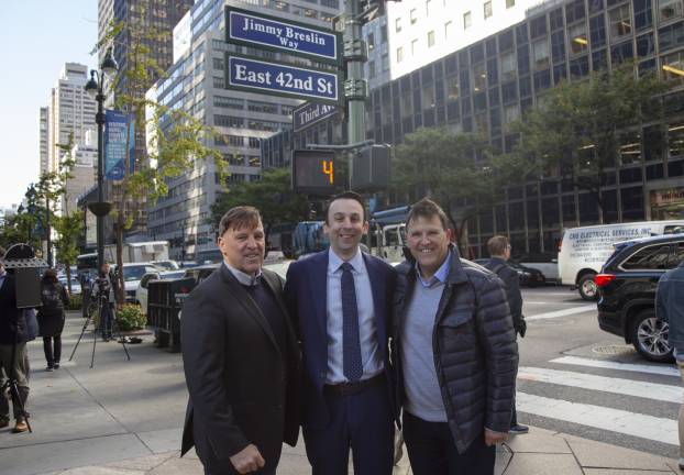 East Side City Council Member Keith Powers is flanked by James Breslin (at left) and his twin brother Kevin at the Oct. 17 unveiling of &#x201c;Jimmy Breslin Way&#x201d; on a stretch of East 42nd Street near the landmark Daily News Building. Photo: New York City Council Photographer John McCarten