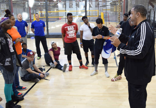Pastor Kevin Cooper, a chaplain to the New York Knicks, spoke with homeless youth participating in a Covenant House health and fitness initiative designed to build confidence and break down obstacles. Photo: Richie Colon