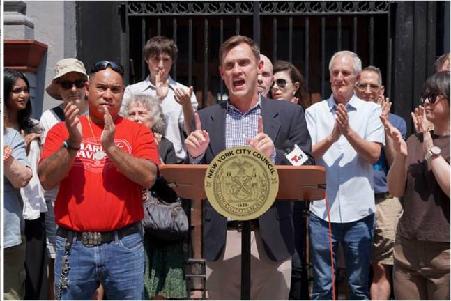 Carl Wilson led preservationists in a “Stop the Sale” rally outside Our Lady of Guadalupe Church in Chelsea after learning the Archdiocese plans to sell the church and two former Catholic school buildings on the west side. He wants the Landmarks Preservation Commission to declare the buildings landmarks.