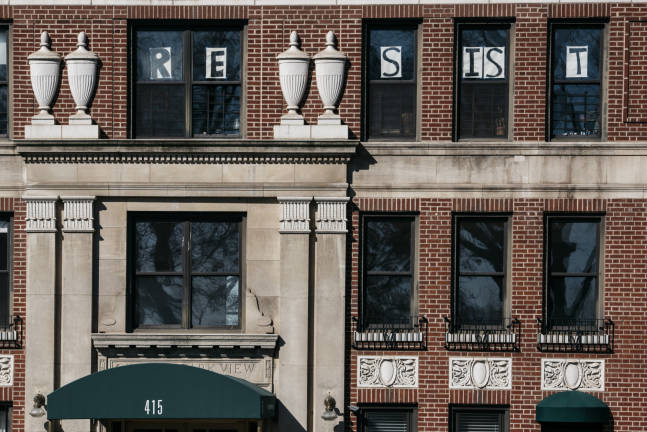 &#x201c;People in the building wanted to show unity and resist against everything that&#x2019;s happening in the Trump government,&#x201d; said one resident of a 17-story co-op at 101st Street and Central Park West, where several displayed similar sentiments. Photo: Joe Carrotta