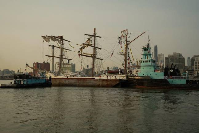 The Cuauhtémoc being towed June 6. It suffered damage resulting in the death of two Mexican naval cadets when it crashed into the Brooklyn Bridge on May 17.