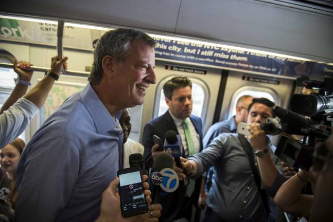 Mayor Bill de Blasio holds a press conference on the F train in Park Slope, Brooklyn, on Sunday, July 23. Photo: Ed Reed / Mayoral Photo Office, via flickr