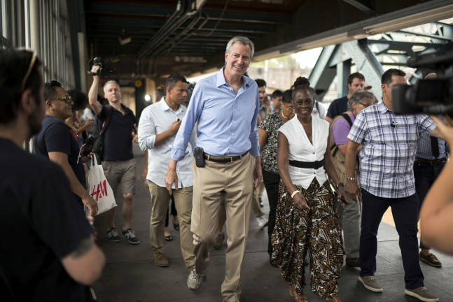 After yet another calamity amid the summer heat wave, a second subway derailment, Mayor Bill&#xa0;de Blasio and wife Chirlane McCray head for a press conference on board the F train in Park Slope, Brooklyn, on Sunday, July 23. Photo: Ed Reed / Mayoral Photo Office,&#xa0;via flickr