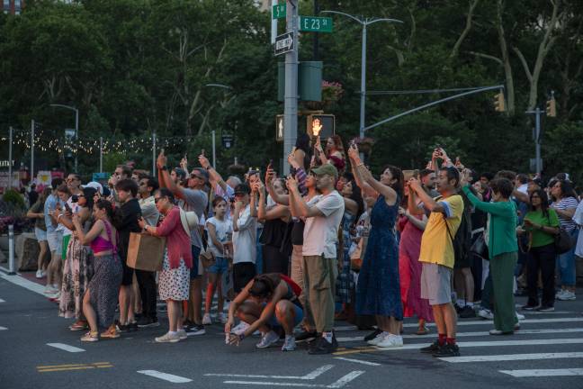 The spectacle brings together people from all over the city and all over the world, all aiming to strike the perfect picture of the striking sunset.