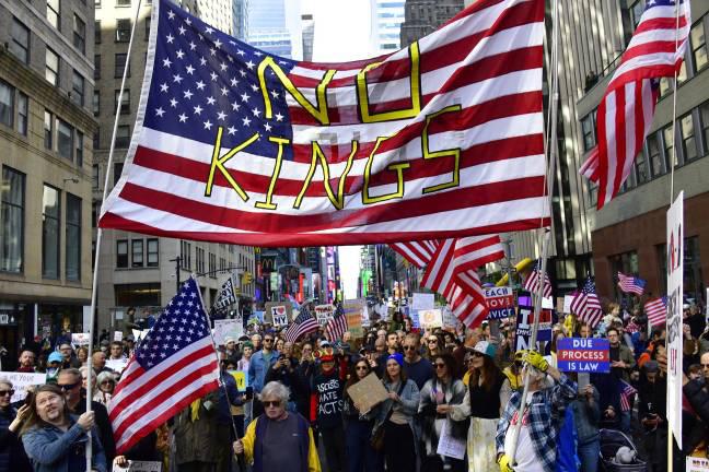 A crowd estimated at over 100,000 marched in Manhattan on Oct. 18 as part of the nationwide No Kings Day.