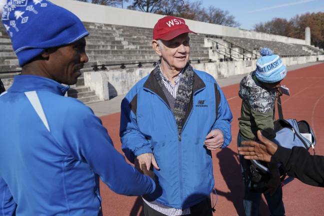 NYC Marathon star Girma Bekele Gebre (left) with Bill Staab (center) of the West Side Runners' Club Runners after a workout at Van Cortlandt Park in the Bronx on Nov. 26, 2019.