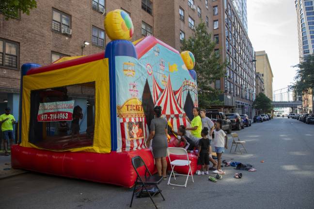 Kids were able to play in a bouncy house set up by the NYPD’s 10th Precinct as part of the National Night Out Against Crime in Chelsea on Aug. 4.