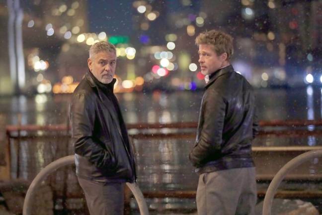 Long time plays George Clooney (left) and Brad Pitt, who are starring in Wolves, a new thriller for Apple Original Films, captured while filming at the South Street Seaport. Photo: Steve Sands/New York Newswire