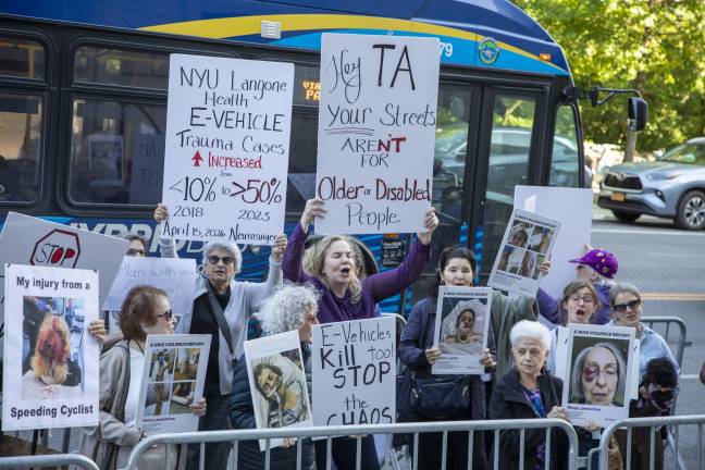 Protesters gather outside Transportation Alternatives’ annual fundraiser to call for stricter regulation of e-bikes and other micromobility devices.
