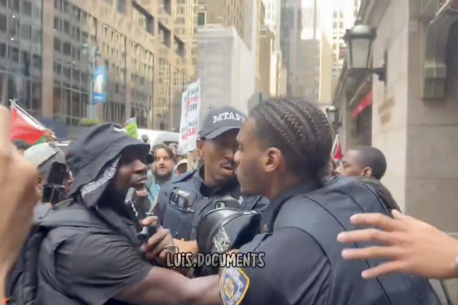 Protesters assault police with shouted taunts and epithets.