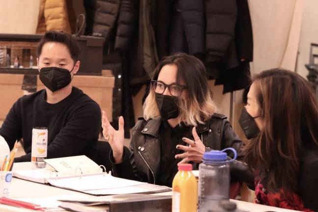 During a rehearsal of “Golden Shield,” Anchuli Felicia King (center) speaks to the cast and crew. Performances begin on April 26 and opening night is on May 17. Photo: Lia Chang