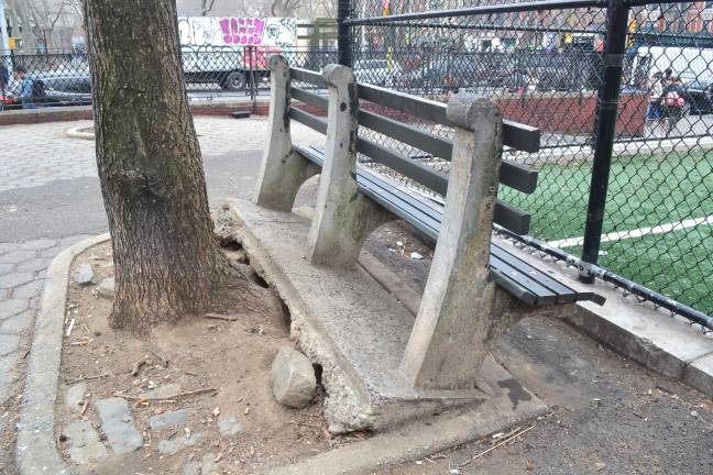 An uprooted bench tilts askew in Sara D. Roosevelt Park south of Houston Street downtown. Photo: John Surico / Center for an Urban Future