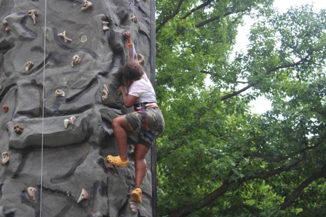 A climber ascends the rock climbing wall. Photo: Meryl Phair