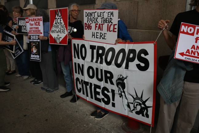 Several signs called for the abolishment of ICE and protested the deployment of the National Guard troops in U.S. cities.