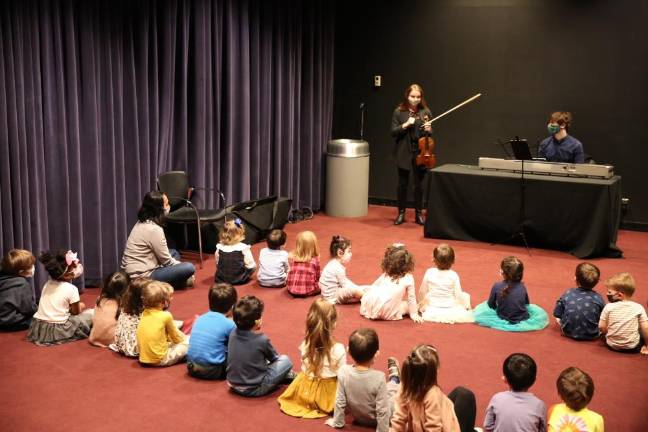 Leerone Hakami and Shay Slusky with students. Photo courtesy of West Amadeus Music Studio