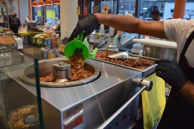 Making candied pecans.