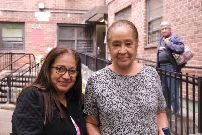 Delfena Plasencea and Maria Moneira in front of their Chelsea-Elliot apartment on 10th Avenue and 26th Street. Photo: Beau Matic.