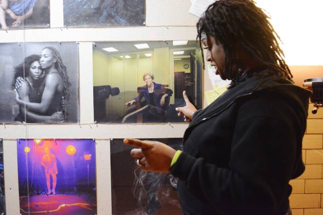 Marcie Chase, who served time at the former Bayview Correctional Facility, worked at the recent Annie Leibovitz portrait exhibition held there and shared stories related to the images. Pointing to a photo of Elizabeth Warren, Chase said the U.S. senator from Massachusetts could have been the first woman president of the United States. Photo: Diamond Naga Siu