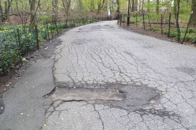 A jumble of cracks and deep potholes mar the pavement in Riverside Park on the Upper West Side. Photo: John Surico / Center for an Urban Future