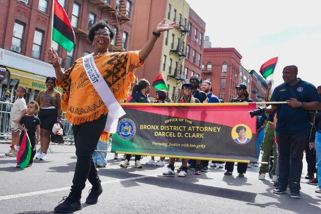 Bronx District Attorney Darcel Clark, waving, at the African-American Day Parade.