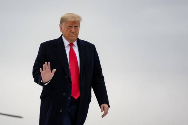 President Donald J. Trump disembarks Marine One at Valley International Airport in Harlingen, Texas Tuesday, Jan. 12, 2021, and boards Air Force One en route to Joint Base Andrews, Md. Official White House Photo by Shealah Craighead