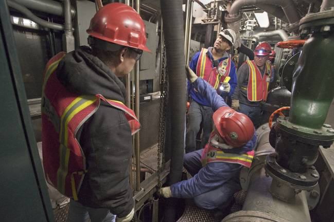 MTA employees used a pump train as they worked around the clock to pumping seawater out of the L train's tunnel following a storm surge in November 2012. Reconstruction of the tunnel, starting in a year, will likely to close the tunnel for the duration, leading to what some fear will be traffic chaos above ground, particularly along 14th Street. Photo: Metropolitan Transportation Authority/Patrick Cashin.