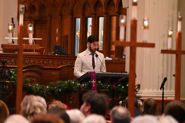 Congregants participated in the Lessons &amp; Carols service by taking turns doing Scripture readings.