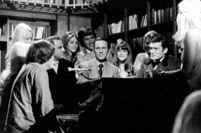 A 1970 press photo for the syndicated TV show &quot;Playboy After Dark,&quot; which was in taped in Los Angeles. Hugh Hefner (in tuxedo) is at far right, actor-comedian Don Adams, who played Maxwell Smart, also known as &quot;Agent 86,&quot; in the comedy &quot;Get Smart,&quot; is at center, and Playboy cover girl and longtime Hefner girlfriend Barbi Benton is seated between them.&#xa0;Photo: Playboy Enterprises,&#xa0;via&#xa0;Wikimedia Commons