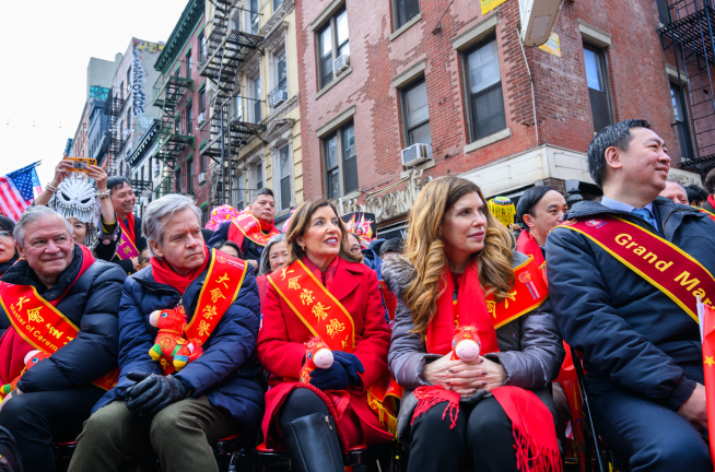 Pols hob knob with honorees including Gov. Kathy Hochul (center), Borough president Brad Hoylman-Sigal (left of Hochul) and City Council Speaker Julie Menin. They each hold a stuffed animal toy Fire Horse.
