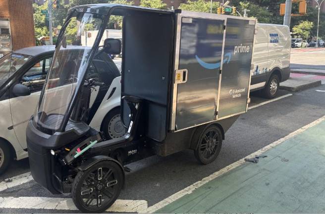 A driver of an Amazon e-van delivery vehicle similar to the one above deliberately drove the vehicle into a pedestrian who had admonished him at E. 57th St. and First Ave.