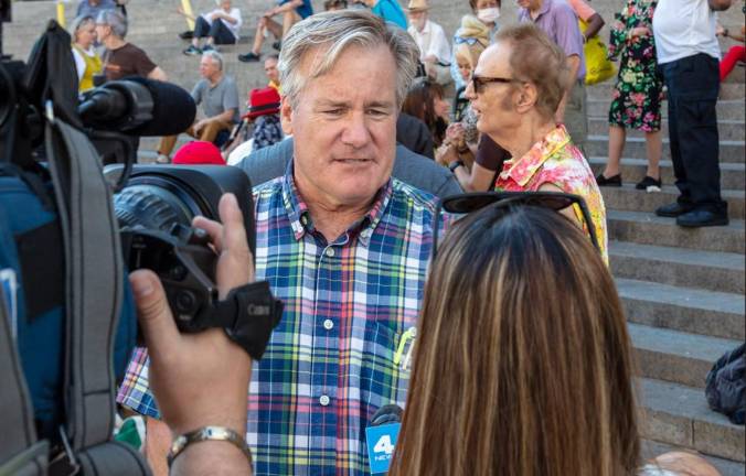 Sam Turvey, an activist on Penn Station redevelopment plans, talks to the press after a demonstration back in 2022. He says Amtrak’s Andy Byford is justified in blasting MTA chief Janno Lieber for stalling on the station’s multi-billion renovation plans.