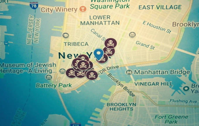 The blue dot indicates Urban Assembly of Emergency Management High School on Pearl Street, while the skull and crossbones buttons represent the cluster of tobacco retail outlets surrounding the school.