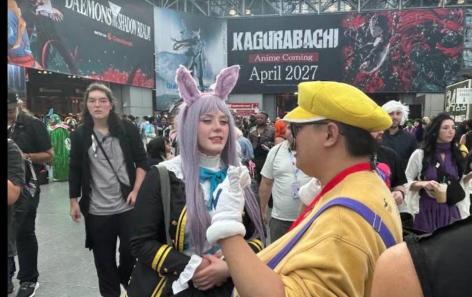 A fan dressed as Wario, the evil doppelganger of Mario chats up a gothic bunny.