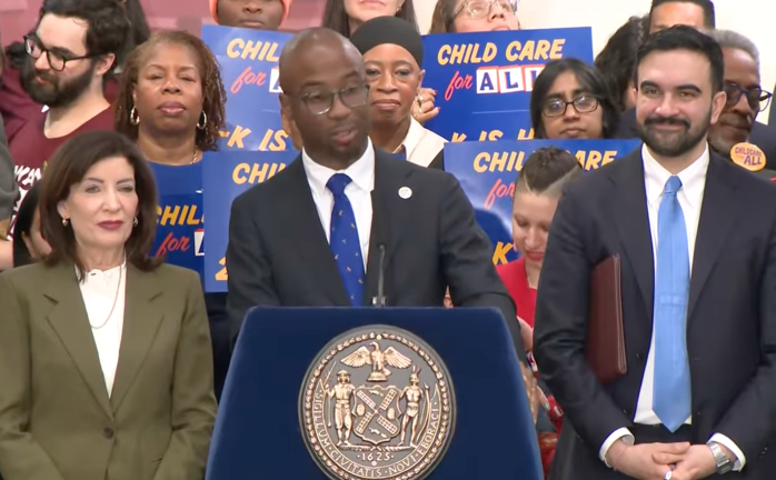 At a March 3 press conference that included Mayor Mamdani (right) and Gov. Kathy Hochul, City Schools Chancellor Kamar Samuels (center) said the fall rollout was an “initial phase and not a final answer.”