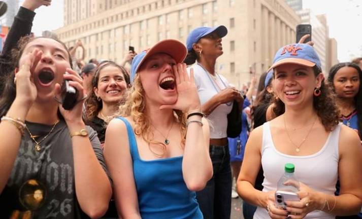 Exuberant fans cheer on the Knicks along the Canyon of Heroes.