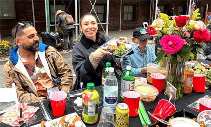 Sharing food is a big part of the Longest Table in Chelsea.