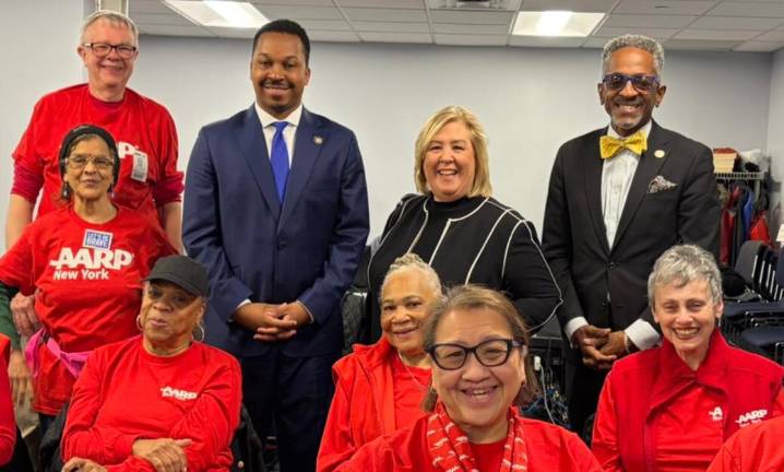 Seawright, as well as her colleagues Jordan J.G. Wright (left) and Al Taylor (right), pictured with representatives of the AARP on Dec. 2.