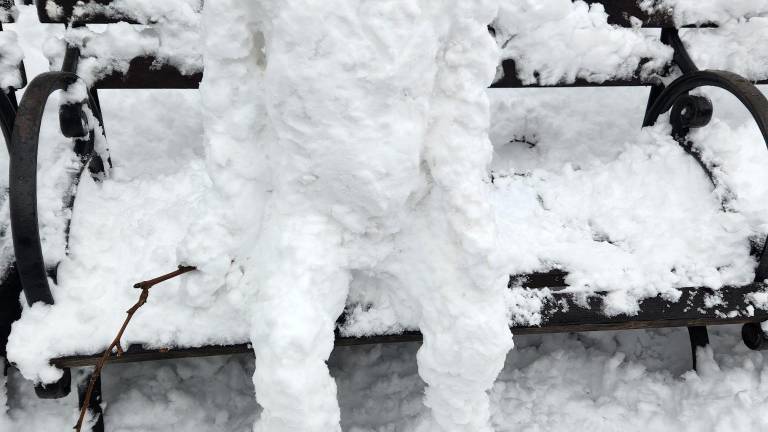 A seated snowman outside Madison Square Park on Feb. 23. Maybe he was waiting for the park to reopen.