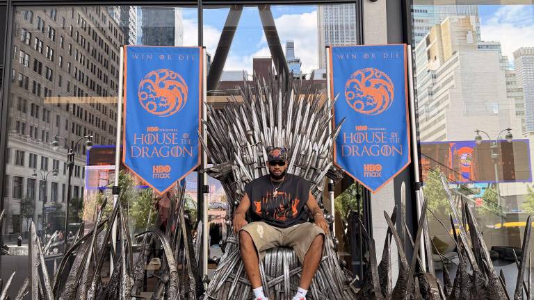 Karl-Anthony Towns, part of the NBA Championship-winning Knicks team, sat atop the Iron Throne prior the premiere House of the Dragon season 3 June 21.