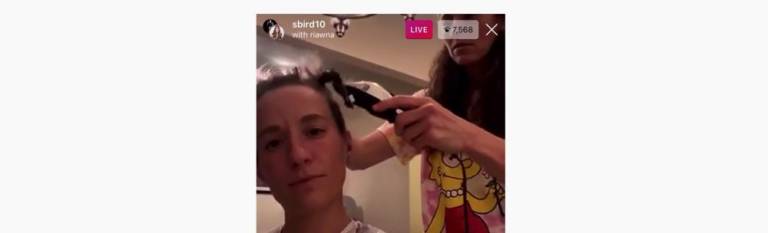 At-home haircut: Megan Rapinoe and Sue Bird.