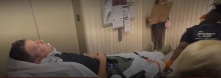 L. Vural Elibol, with Turkey’s Anadolu news agency, is taken away on a stretcher after a collision that caused him to bang his head at 26 Federal Plaza after ICE agents forced <i>amNY</i> journalist Dean Moses from a public elevator. They were covering immigration hearings.