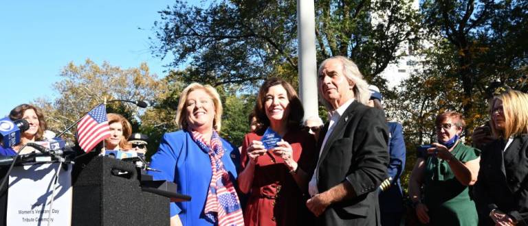 Center left to right: Assembly Member Rebecca Seawright, Gov. Kathy Hochul and Howard Teich at a ceremony on Nov. 9, 2021 honoring Women’s Veterans Day at the Women’s Flagstaff and Grove in Central Park. Photo: Kevin P. Coughlin / Office of the Governor
