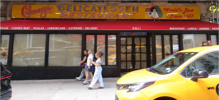 Paper is still covering the windows at the site where the Carnegie Deli, once a legendary Jewish deli famed for its big oversized sandwiches, plans a return this fall at 834 Seventh Ave.