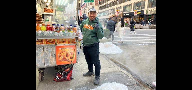Sabrett hot dog vendor Hezo Ahmed drops the beats for the sidewalk runway show.