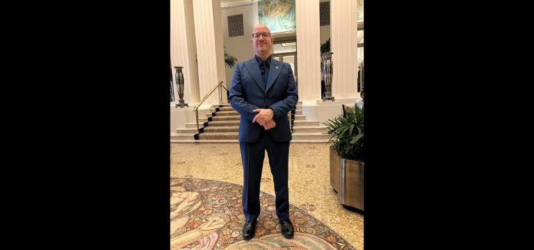 Waldorf Astoria security guard Pedro Rodriguez sports a cool monotone Waldorf blue uniform in the hotel’s Park Avenue lobby.