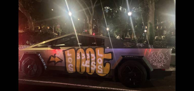 A Tesla Cybertruck, spotted on Chrystie Street, around the corner from Freeman Alley has been hit with “LOOT’s throw” (graffiti tag).