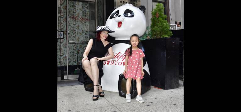 Karen Rempel with Philippe Chow panda and passerby.